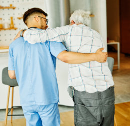 Male doctor at home taking care the elder man