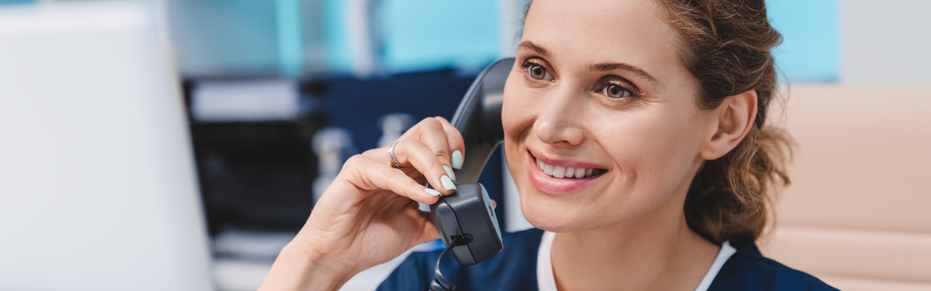 Female nurse calling using telephone