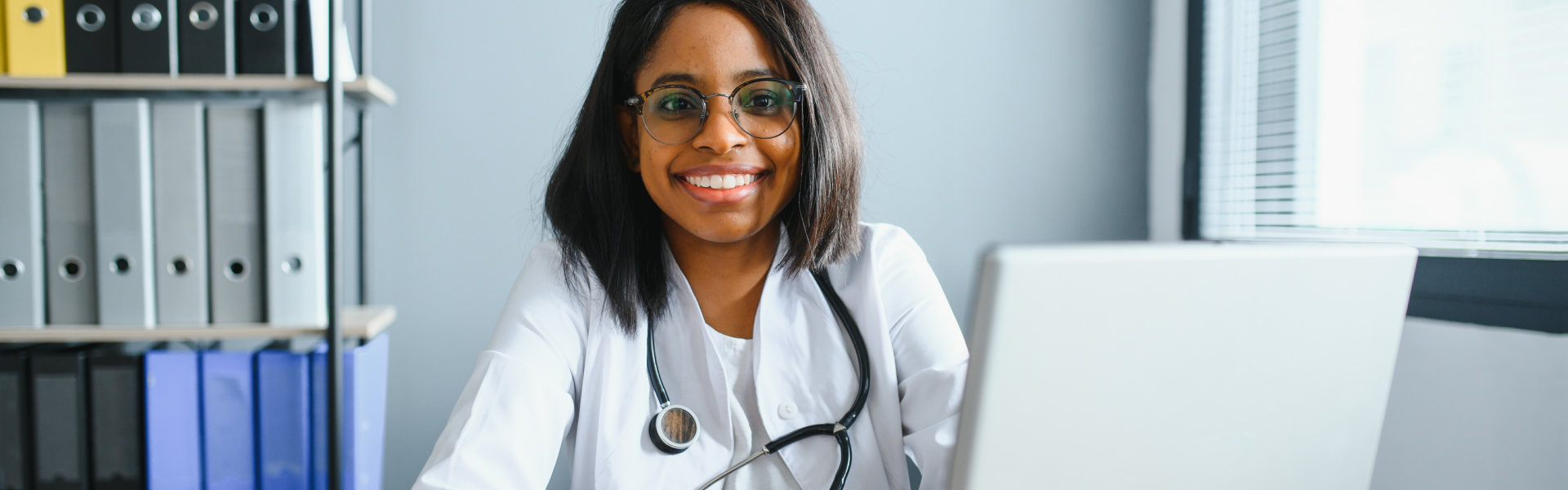 Smiling female doctor at her office